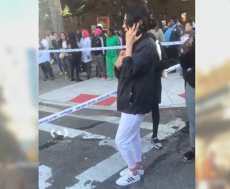 A crowd gathered at the intersection