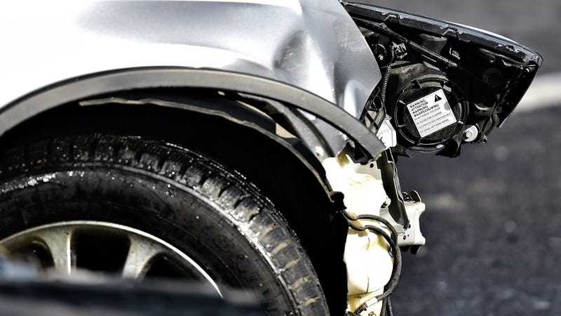 Car crash detail with damaged automobile - stock photo