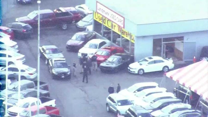 helicopter view of car dealership in Independence, MO after shooting