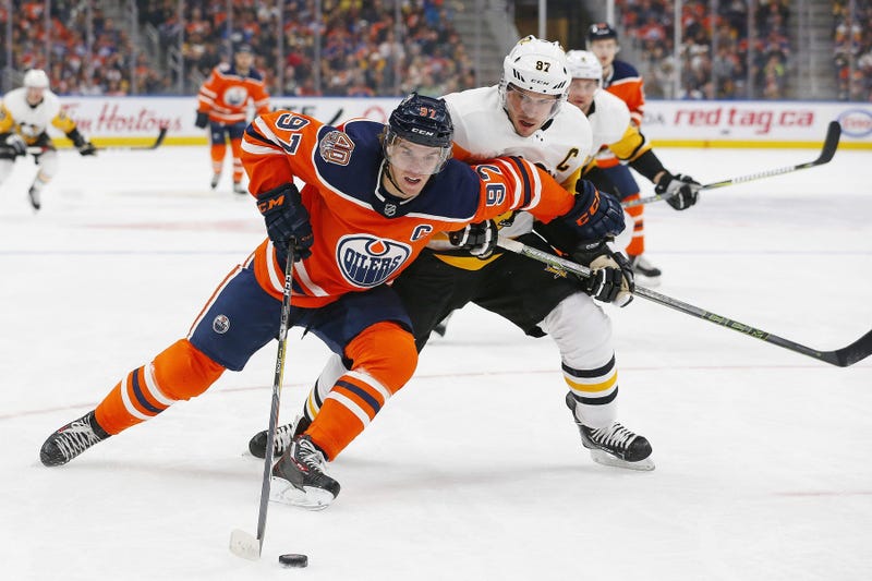 Pittsburgh Penguins forward Sidney Crosby (87) tries to check Edmonton Oilers forward Connor McDavid (97) during the first period at Rogers Place.