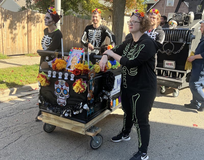casket race contestants dressed in skeleton outfits