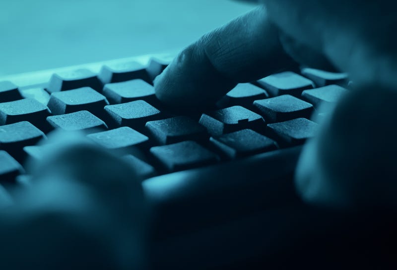 cyber crime illustration fingers on keyboard