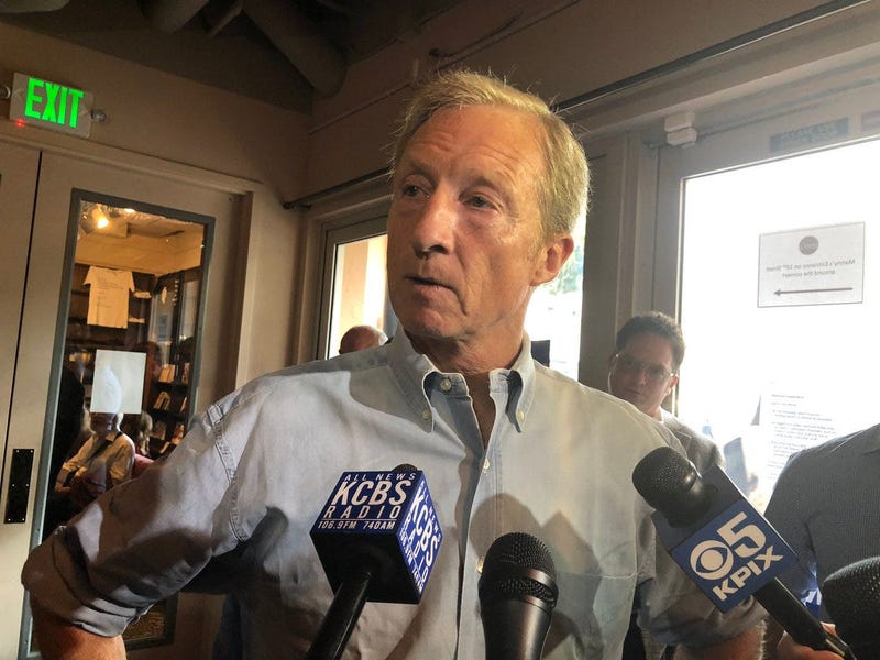 Tom Steyer speaks to reporters during a campaign stop at Manny's, a popular destination for candidates, in San Francisco on July 17, 2019. 
