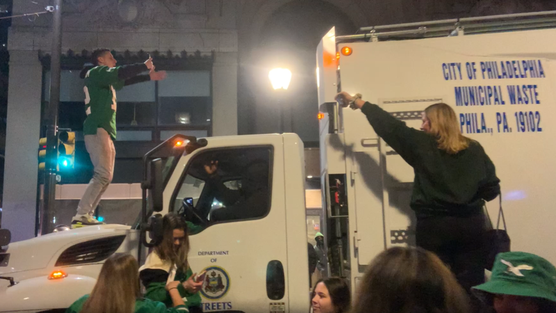 Climbing a garbage truck, Jan. 26, 2025