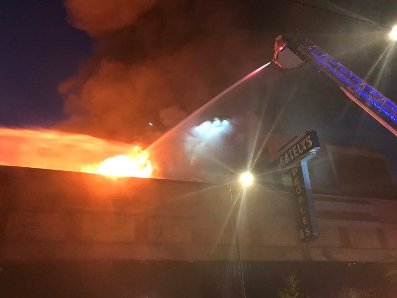 Firefighters are tackling a three-alarm fire at a commercial building in Roseland.