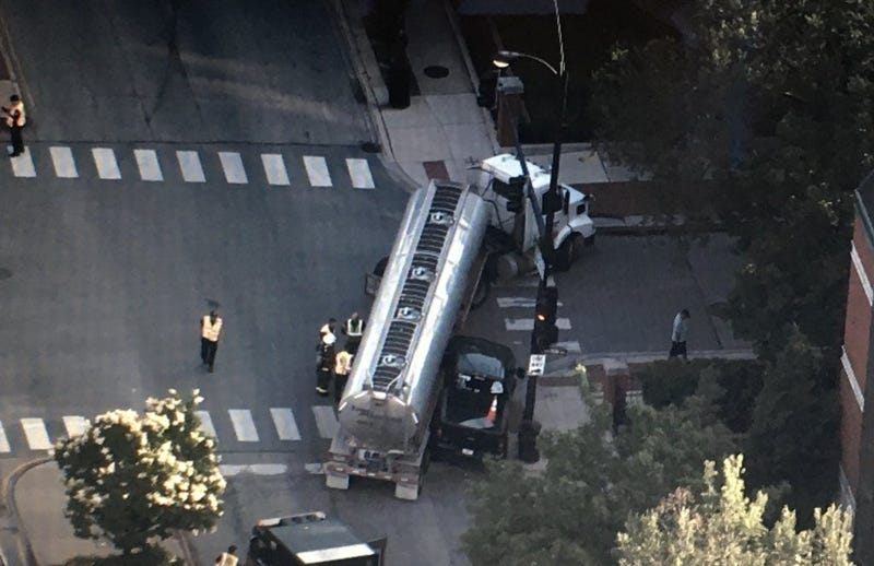 A Near West Side intersection has been shut down as crews work to clean up a fuel spill after a crash involving a semi tanker.