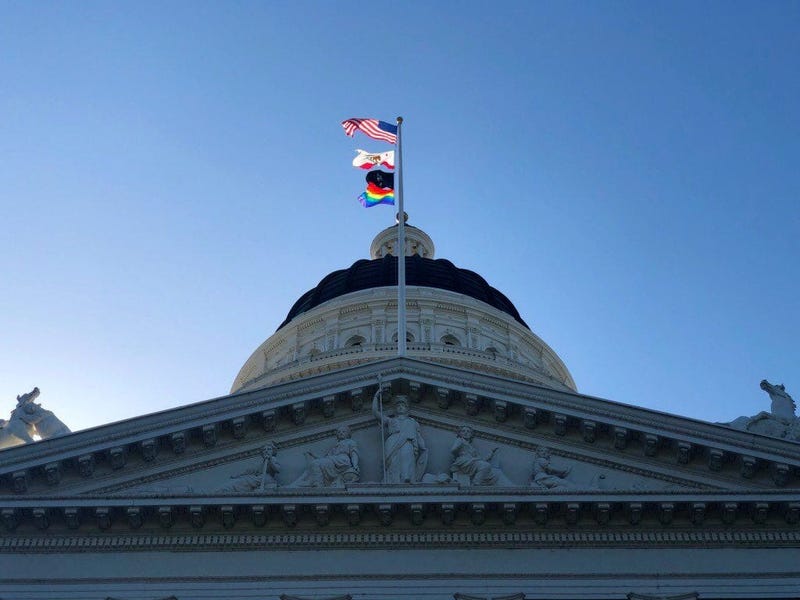 The LGBTQ pride flag flies at the California state capitol in Sacramento on June 17, 2019.