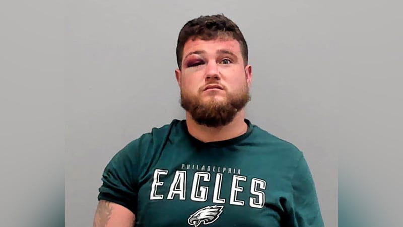 Martin Dalasandro, wearing Eagles t-shirt with black eye in mugshot