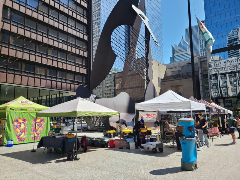 farmer's market under the Picasso statue