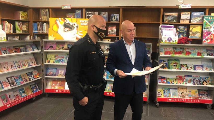 Dallas Police hand out gifts to students at book fair