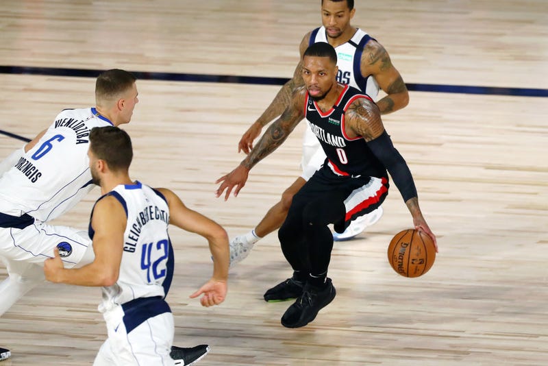 Damian Lillard looks to make a play against the Mavericks. 