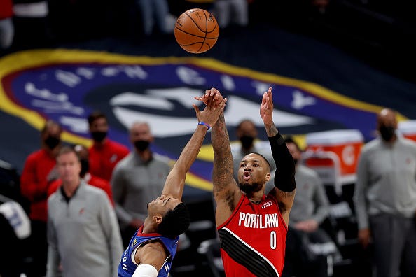 Damian Lillard shoots a 3-pointer vs. the Nuggets. 