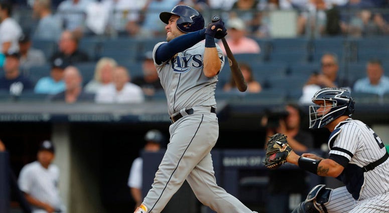 Tampa Bay Rays catcher Travis d'Arnaud hits home run against the Yankees in the first inning at Yankee Stadium on July 15, 2019. 