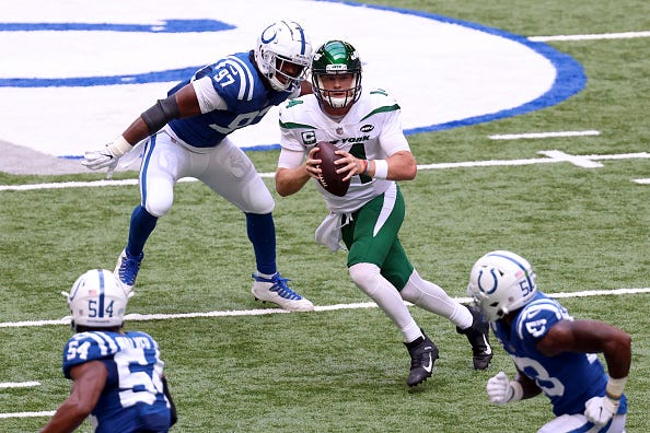 Sam Darnold scrambles under pressure against the Colts
