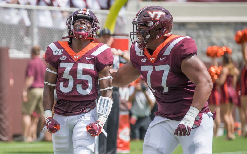 Christian Darrisaw celebrates a TD with his teammate