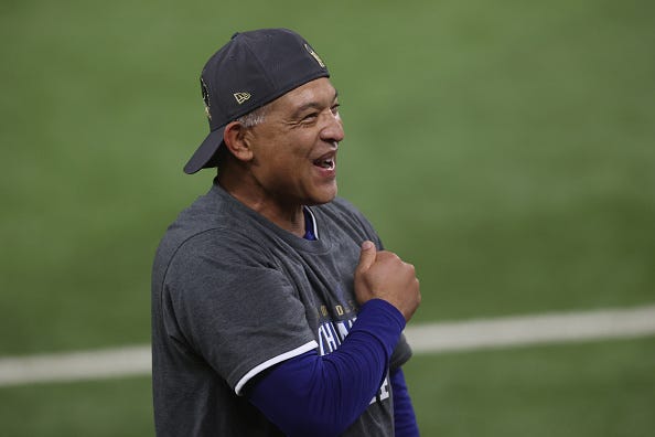 Dave Roberts celebrates the Dodgers winning the World Series