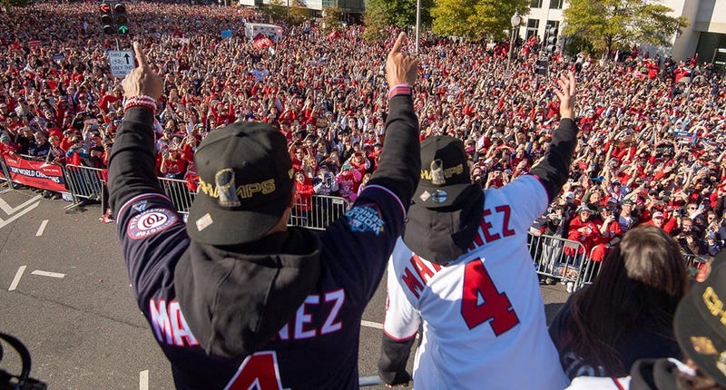 Washington Nationals players and coaches roll through the streets of Washington, D.C. and then speak on stage, celebrating their 2019 World Series championship with a few hundred thousand fans on November 2, 2019. 