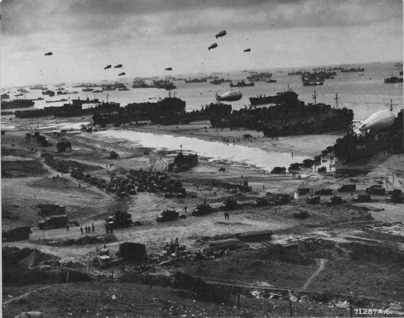 Barrage balloons protect dozens of ships on the Normandy beaches as they offload the men, material, and munitions needed to expand the beachhead.