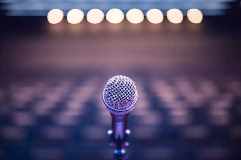 Microphone over a blurred background.