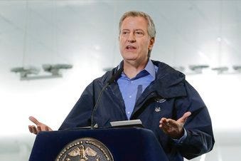 FILE - In this March 31, 2020 file photo, New York City Mayor Bill de Blasio speaks at the USTA Indoor Training Center where a 350-bed temporary hospital will be built in New York. (AP Photo/Frank Franklin II, File)