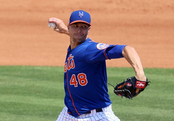 Jacob deGrom pitches in a Mets spring training game.