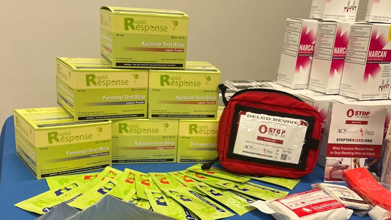 Opioid harm reduction materials, including Narcan and testing strips