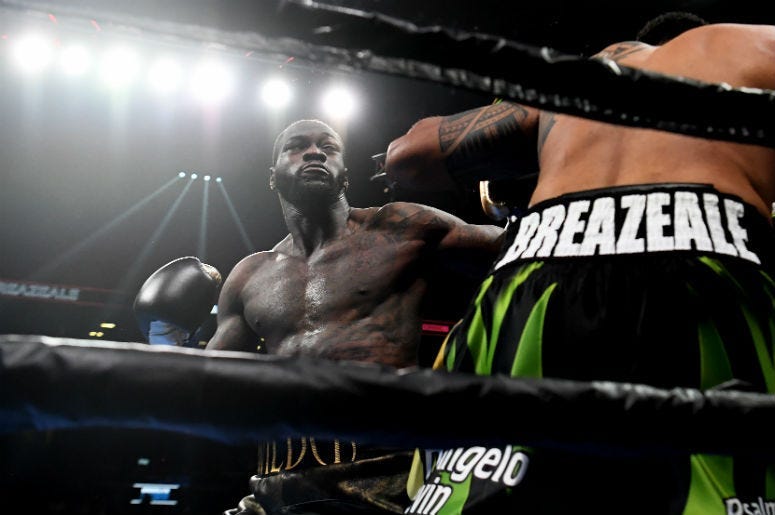 Referee Kenny Bayless moves in to direct Deontay Wilder to a neutral corner after he knocked out Luis Ortiz in the seventh round of their WBC heavyweight title fight at MGM Grand Garden Arena on November 23, 2019 in Las Vegas, Nevada.