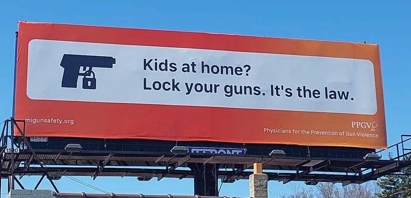 Billboard in Detroit promoting new safe storage law