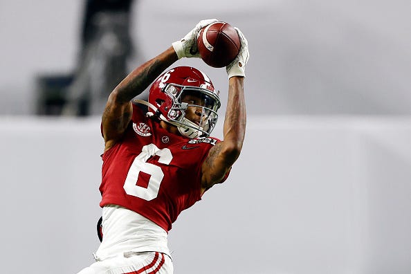 Devonta Smith makes a catch in a game for Alabama. 