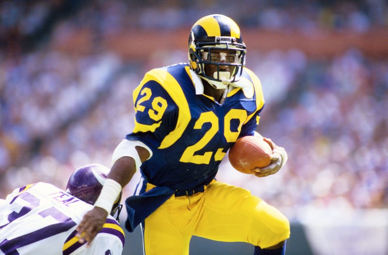 Eric Dickerson breaks a tackle