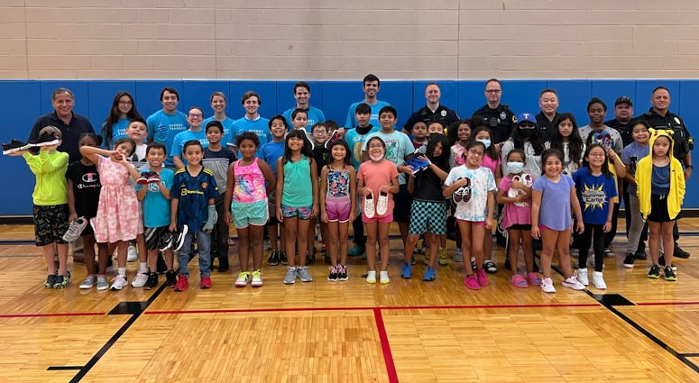 Caring Cops Gift New Shoes to Grateful Children