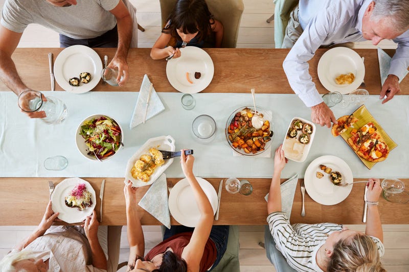 People sharing a meal around a dinner table