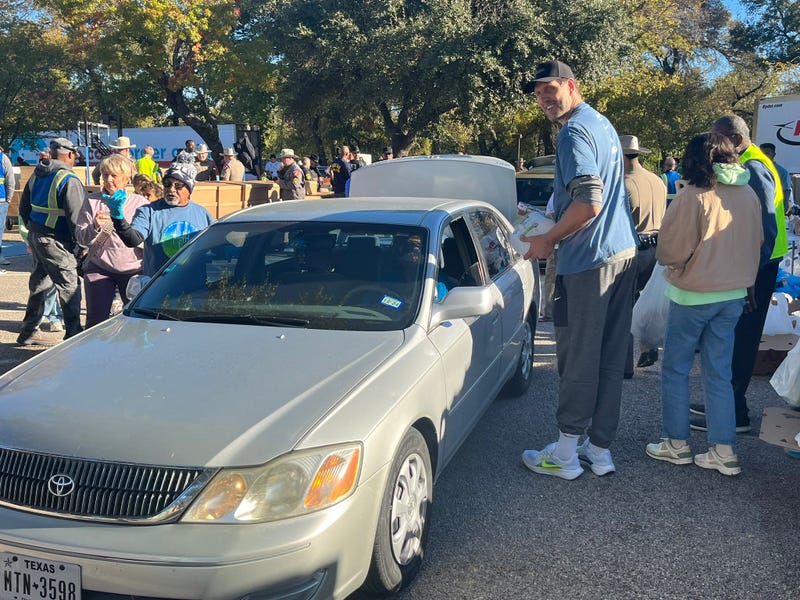 Dirk Nowitzki helps distribute food at a mobile pantry before Thanksgiving on Thursday, Nov. 21, 2024.