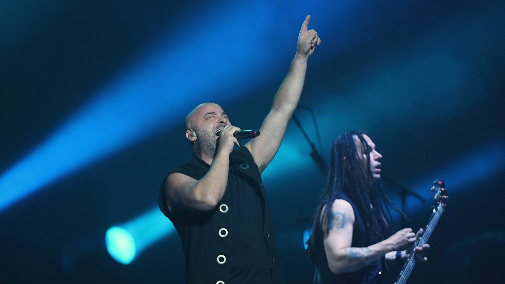 Watch Disturbed get soaked by a sprinkler system after on-stage pyro display