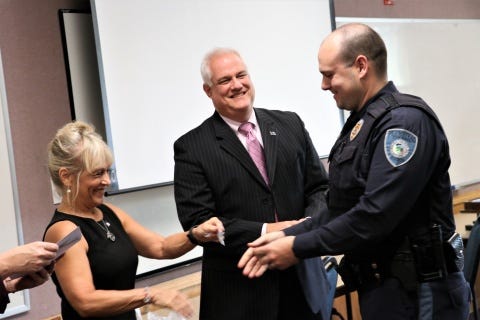 Bucks County Commissioner Diane Marseglia (left) and District Attorney Matt Weintraub (center) attend a Crisis Intervention Training course police graduation.