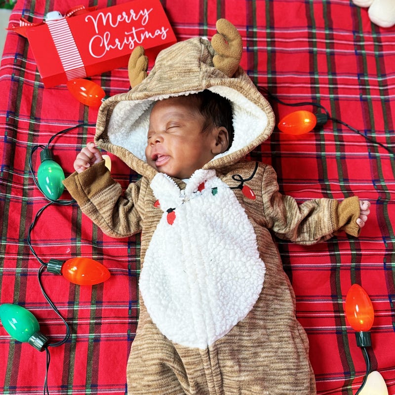 Baby in reindeer onesie