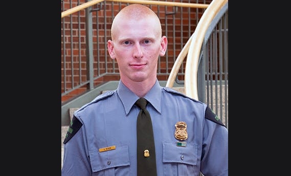 A state trooper and a conservation officer are being credited with the saving an Upper Peninsula resident from a burning home last week, officials say.