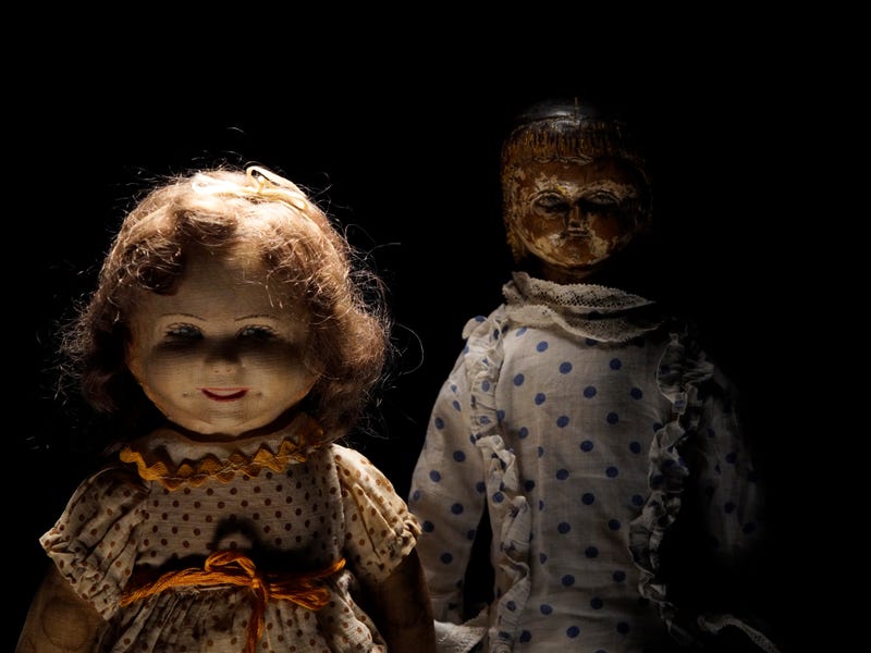 creepy dolls in shadow