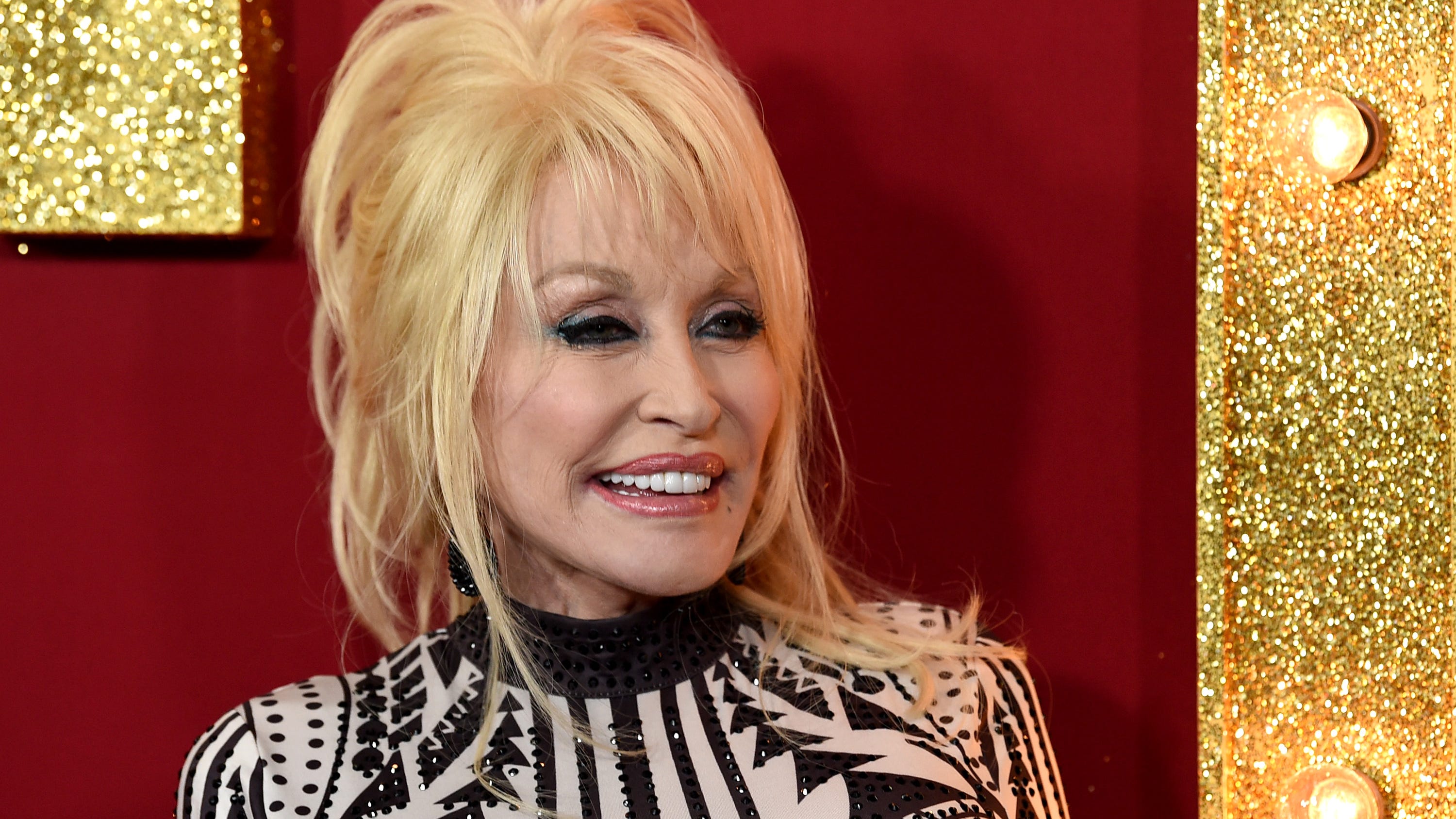 Watch Dolly Parton get the vaccine, 'a dose of her own medicine'