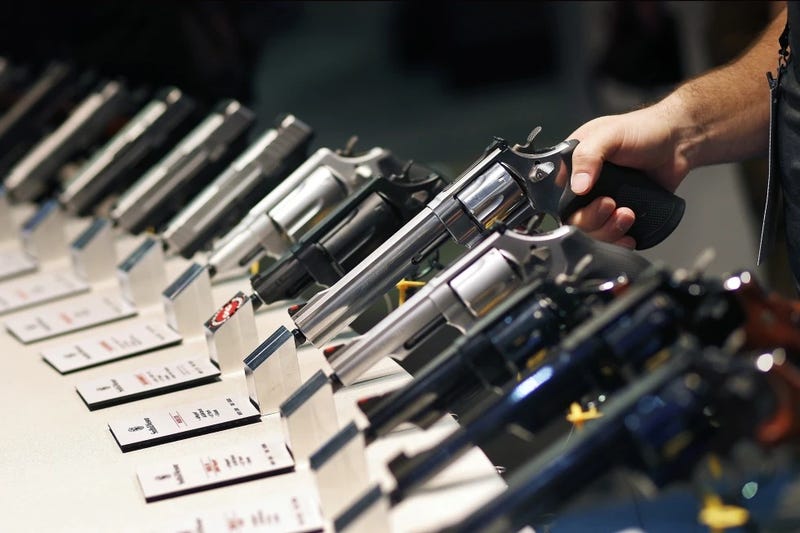 In this Jan. 19, 2016 file photo, handguns are displayed at the Smith & Wesson booth at the Shooting, Hunting and Outdoor Trade Show in Las Vegas. 