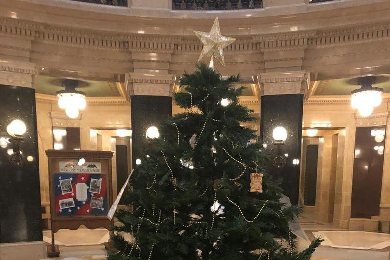 An artificial Christmas tree that Republican lawmakers set up stands in the Wisconsin Capitol rotunda Monday, Dec. 7, 2020, in Madison, Wis. GOP Reps. Paul Tittl and Shae Sortwell erected the tree without a permit after Gov. Tony Evers' administration decided to forego the state's annual tradition of placing a towering evergreen in the rotunda since the building is closed due to the coronavirus pandemic.