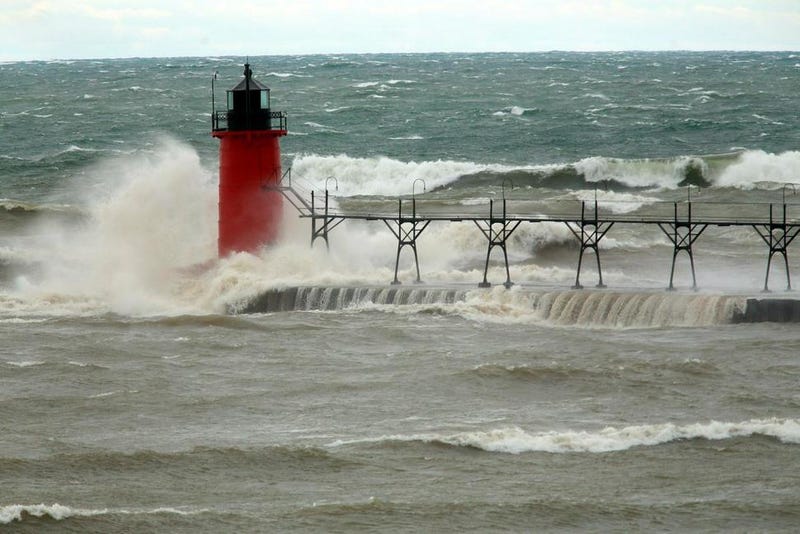FILE - In this April 6, 2017 file photo, strong winds send huge waves at the Lake Michigan shoreline at South Haven Michigan. A decade-old program that has pumped $2.7 billion into healing long-term injuries to the Great Lakes environment has received authorization from Congress to continue another five years. The U.S. Senate voted unanimously Sunday, Dec. 20, 2020, to extend the Great Lakes Restoration Initiative, which the House did earlier this year.