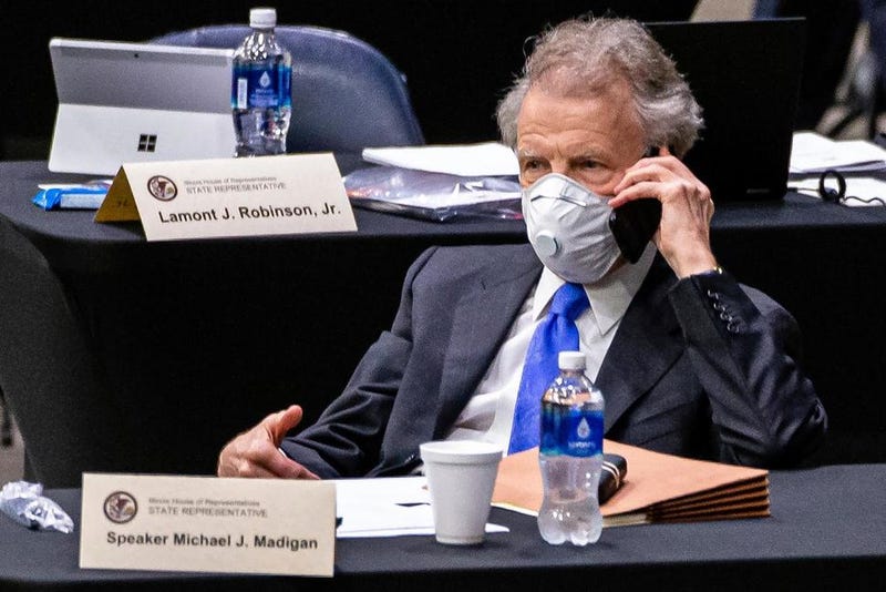 In this May 23, 2020 file photo, Illinois Speaker of the House Michael Madigan, D-Chicago, talks on his cellphone from his desk during an extended session of the Illinois House of Representatives at the Bank of Springfield Center, in Springfield, Ill.
