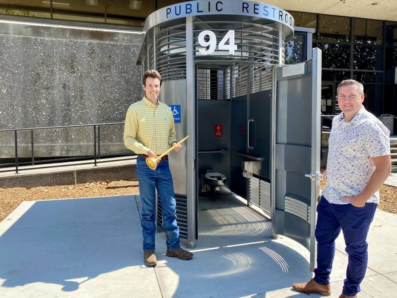 Santa Rosa Councilman Jack Tibbetts (left) and Mayor Chris Rogers celebrate the opening of the "Portland Loo".