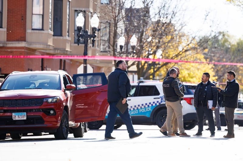 Police work the scene in the 2400 block of South Oakley Avenue where a young child was shot and a man killed on Nov. 20,2024.