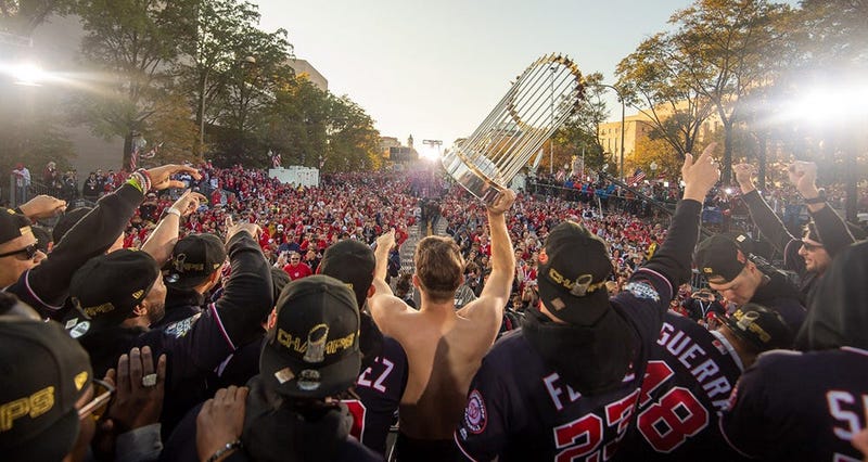 Washington Nationals players and coaches roll through the streets of Washington, D.C. and then speak on stage, celebrating their 2019 World Series championship with a few hundred thousand fans on November 2, 2019. 