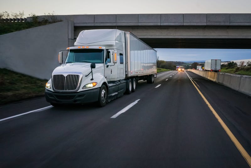 Semi truck under overpass