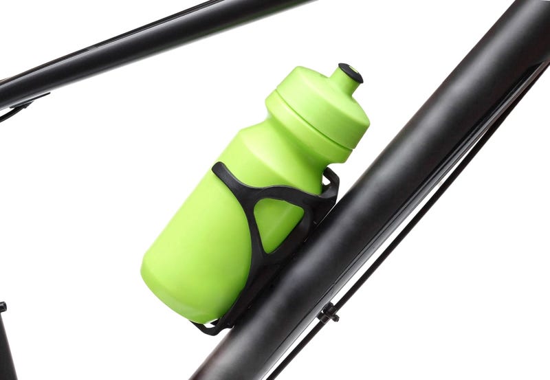 Reusable green water bottle on bike cup holder