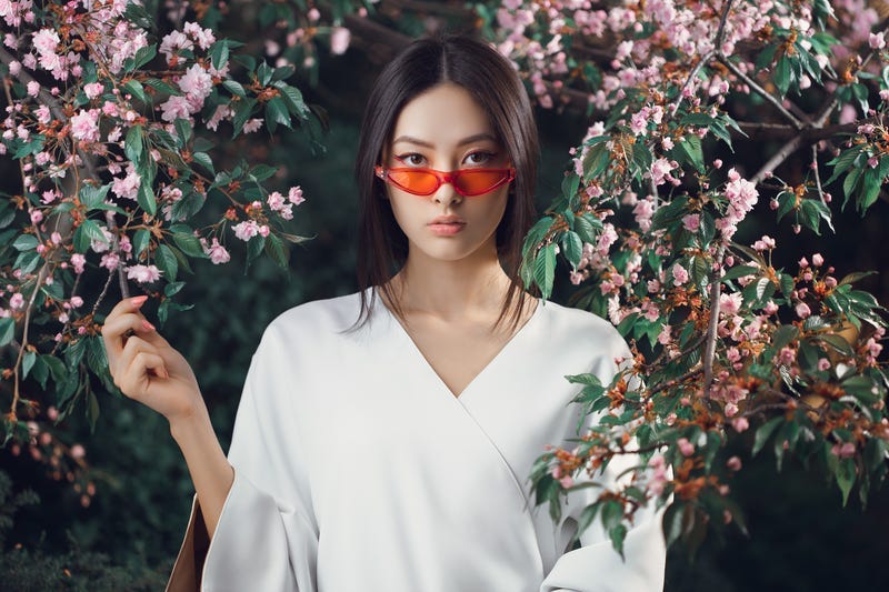 Asian woman fashion close-up portrait outdoors. Lady, fantasy.