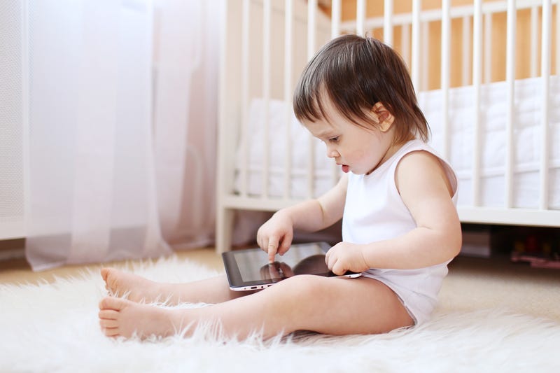 Baby playing with tablet
